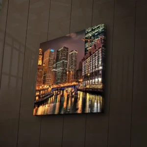 Canvastavla med LED-belysning 28x28 cm - Stadssilhuett med upplysta skyskrapor vid en vattenkant Guld / Blå / Svart - Inredning Beställ idag