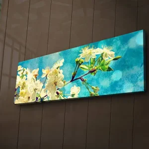 Trygg betalning Canvastavla med LED-belysning 30x90 cm - Blommande körsbärsgrenar mot en ljusblå bakgrund Vit / Ljusblå / Grön - Inredning
