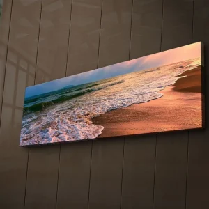 Canvastavla med LED-belysning 30x90 cm - Vacker strand med solnedgång och mjuka vågor Blå / Orange / Beige - Inredning Outlet