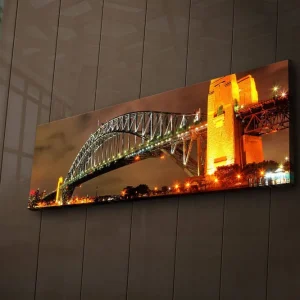 Canvastavla med LED-belysning 30x90 cm - Sydney Harbour Bridge i kvällsbelysning Guld / Grön / Svart - Inredning Extra rabatt