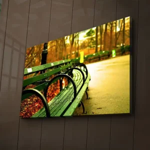 Canvastavla med LED-belysning 45x70 cm - Grön bänk i en höstig parkmiljö Grön / Gul / Brun - Inredning Köp nu