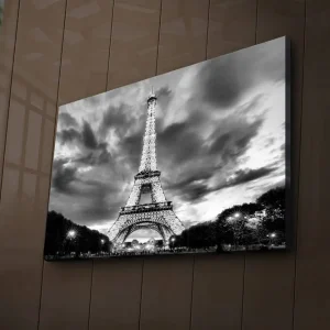 Canvastavla med LED-belysning 45x70 cm - Dramatisk fotobild över upptänt Eiffeltorn i Paris med molnhimmel i svartvit Svart / Vit - Inredning Extra rabatt