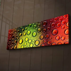 Rabatter Canvastavla med LED-belysning 30x90 cm - Färgglad komposition av droppar på en yta Grön / Röd / Orange - Inredning