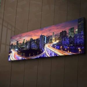 Erbjudandepris Canvastavla med LED-belysning 30x90 cm - Stadssilhuett vid skymning med ljusstrålar från vägarna Mörkblå / Orange / Lila - Inredning