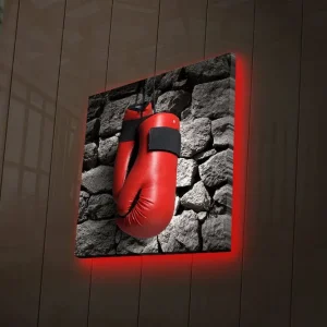Canvastavla med LED-belysning 40x40 cm - Röda boxhandskar hängande mot en grå stenvägg Röd / Grå - Inredning Trygg betalning