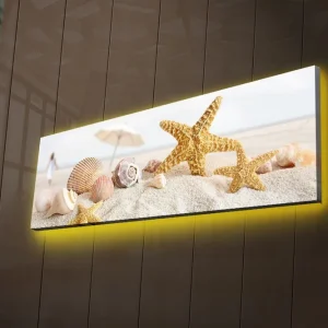 Canvastavla med LED-belysning 30x90 cm - Stjärnformade snäckor på sandstrand Guld / Beige / Rosa - Inredning Kundfavorit