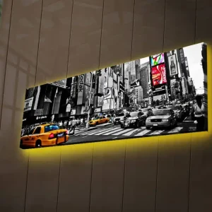 Canvastavla med LED-belysning 30x90 cm - Livlig stadsbild med gula taxibilar i en urban miljö Gul / Svart / Grå - Inredning Rea